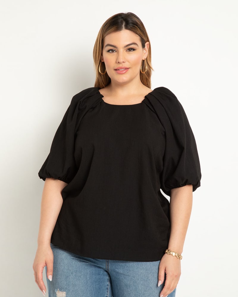 Front of a model wearing a size 22 Puff Sleeve Textured Rayon Top in Totally Black by ELOQUII. | dia_product_style_image_id:303807